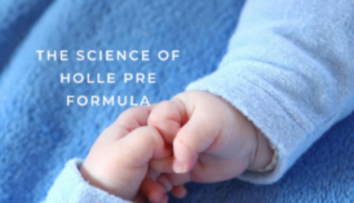 Infant’s hand holding adult’s finger, symbolizing trust in Holle Pre Formula nutrition.